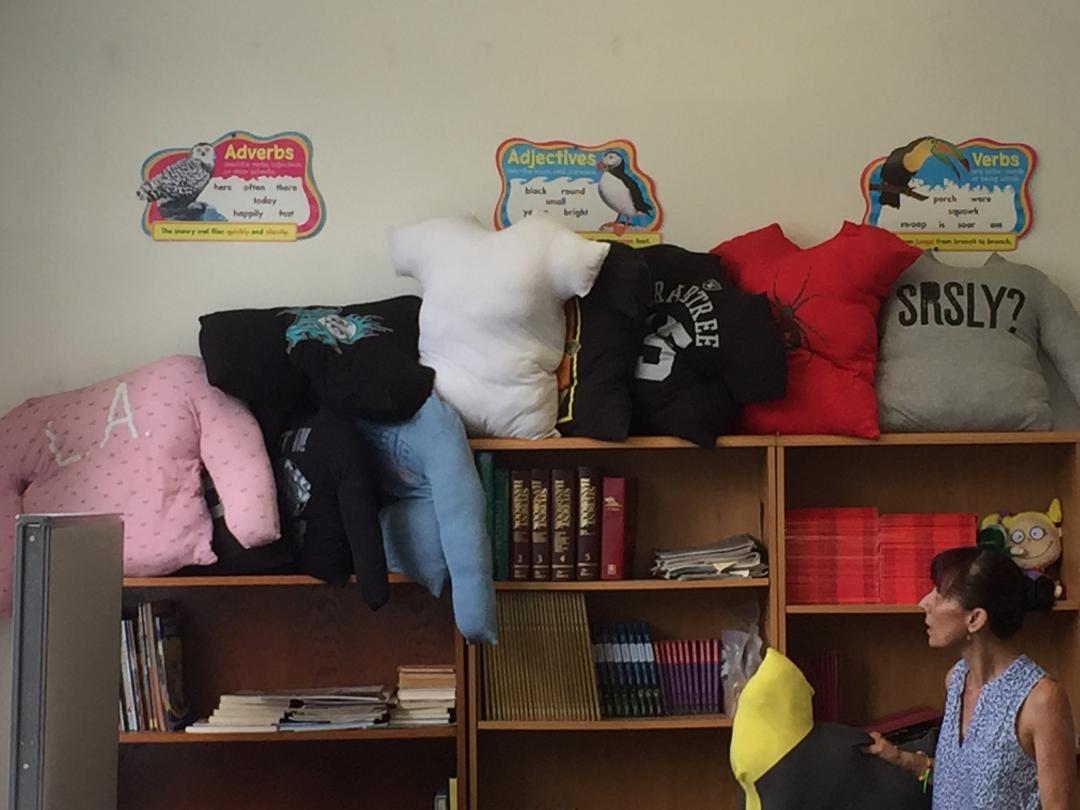  One of the first projects students in the Summer Enrichment and Reading Program embarked upon was stuffing t-shirts for use as pillows during rest breaks. Photo: Steve Newvine 
