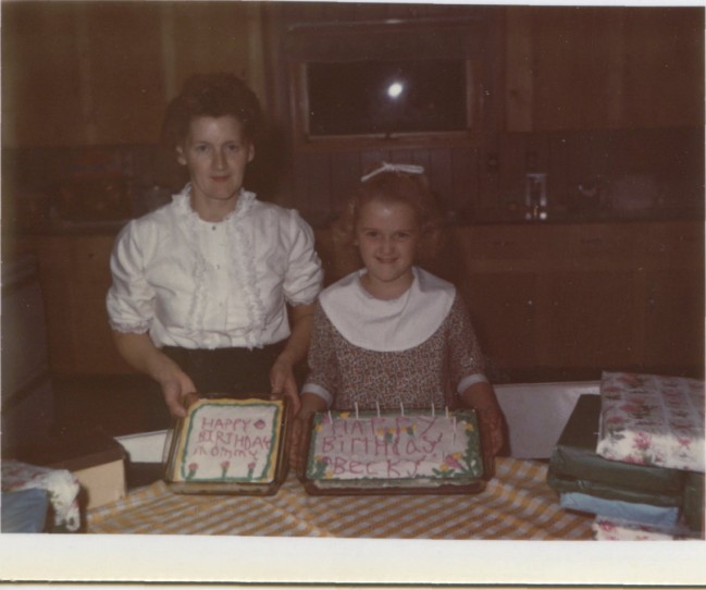 Circa 1970, My Mom and sister Becky celebrate their birthdays together with two cakes.  Photo from the Newvine Personal Collection