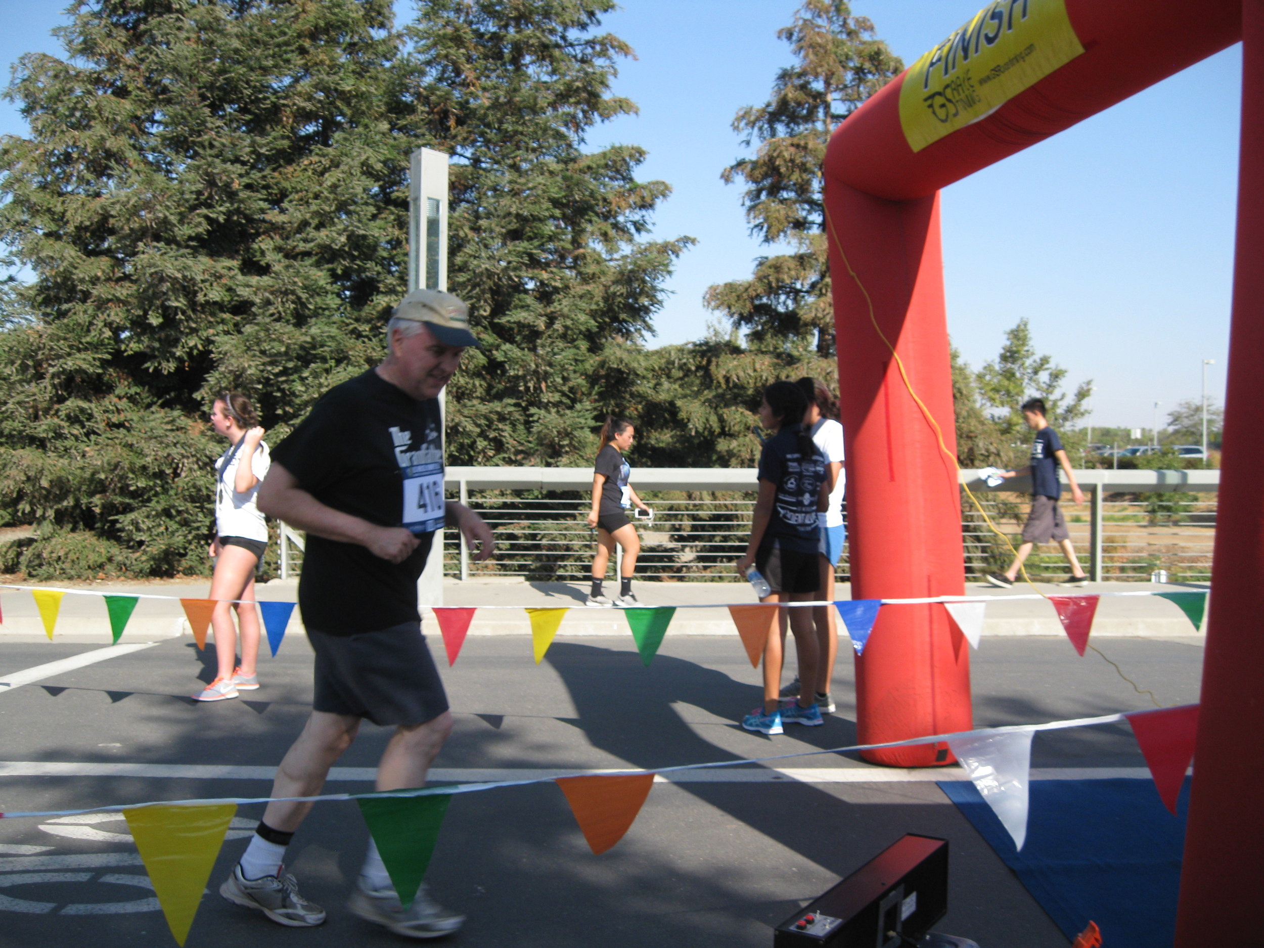  Crossing the finish line at the UC Merced Journey 5-K in September 2016.  Photo from the Newvine Personal Collection 