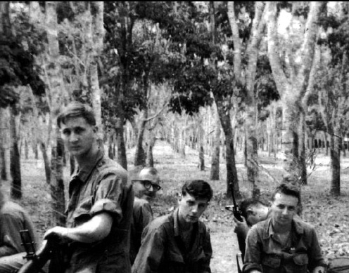  Bill Newvine didn’t seek the spotlight or even the camera’s lens in this photo from his time in Vietnam.  He’s the soldier wearing glasses. Photo: Alpha Association 