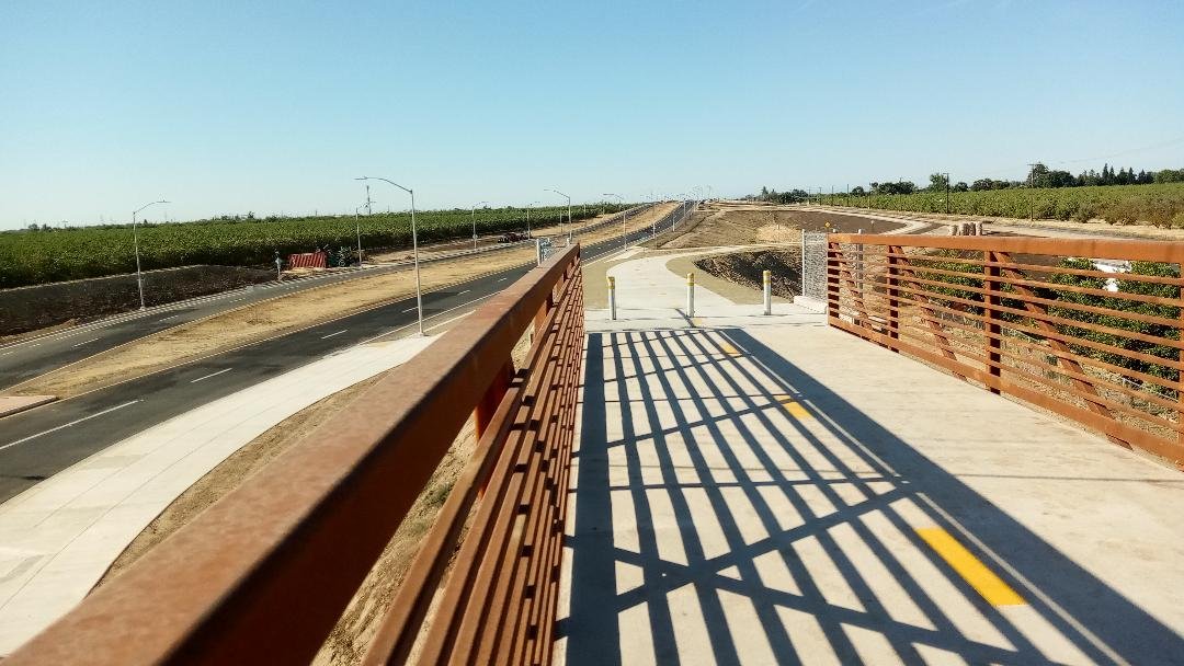  The view from the new bike/pedestrian bridge over the Olive Avenue roundabout section of Campus Parkway.  Photo:  Steve Newvine 