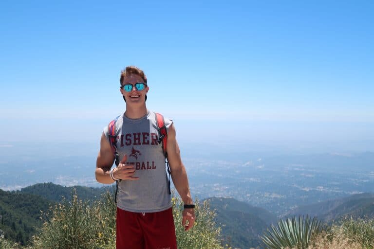  Brennen Thompson is one quarter of his way through climbing twelve peaks in California. He’s shown here on top of Sandstone Peak in Malibu. Photo: ValleyTough.com 