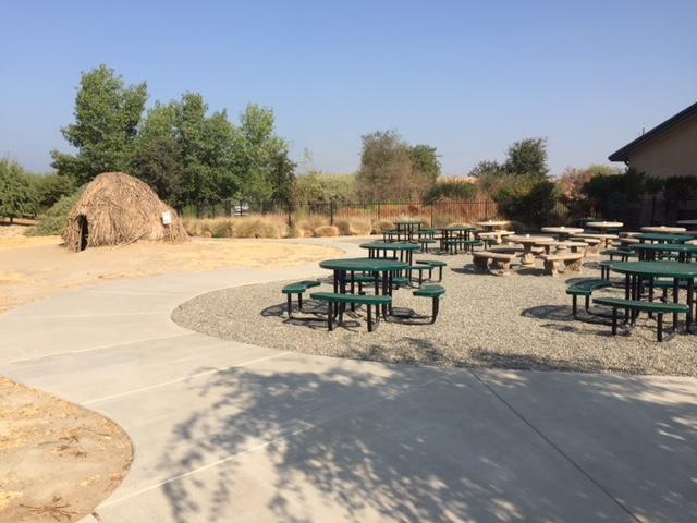  Behind the main building, the Center has a dining area, and two unique outdoor exhibits: a Yokuts house and a Water Resource Exhibit. Photo: Steve Newvine 