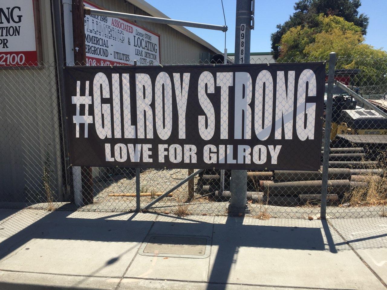  This banner in the downtown area is one coping mechanism residents are using to deal with the July shooting at the Gilroy Garlic Festival. Photo: Steve Newvine 