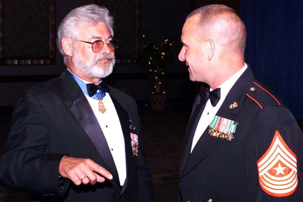   Jon Cavaiani (left) at a ceremonial function.  Photo from Military.com)  
