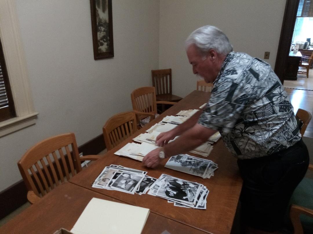  Merced County Courthouse Museum docent Tom Gaffrey works on the multi-year project to categorize, digitize, and electronically store more than ten thousand pictures acquired from the Merced Sun-Star. Photo: Steve Newvine 