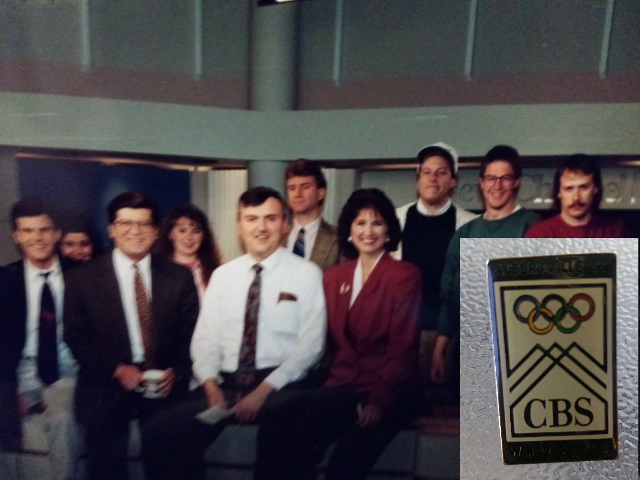   Part of the news team I worked with thirty years ago. I’m the guy in the white shirt, tie, and dark hair.   Inset: a special pin made in anticipation of the 1992 Winter Olympics in Albertville, France.  Photo: Newvine Personal Collection 