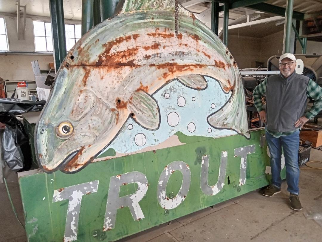  Kern County Museum Executive Director Mike McCoy stands next to the sign for Trout’s Bar. The sign will soon be placed in front of the Bakersfield Sound exhibit. Photo: Steve Newvine 
