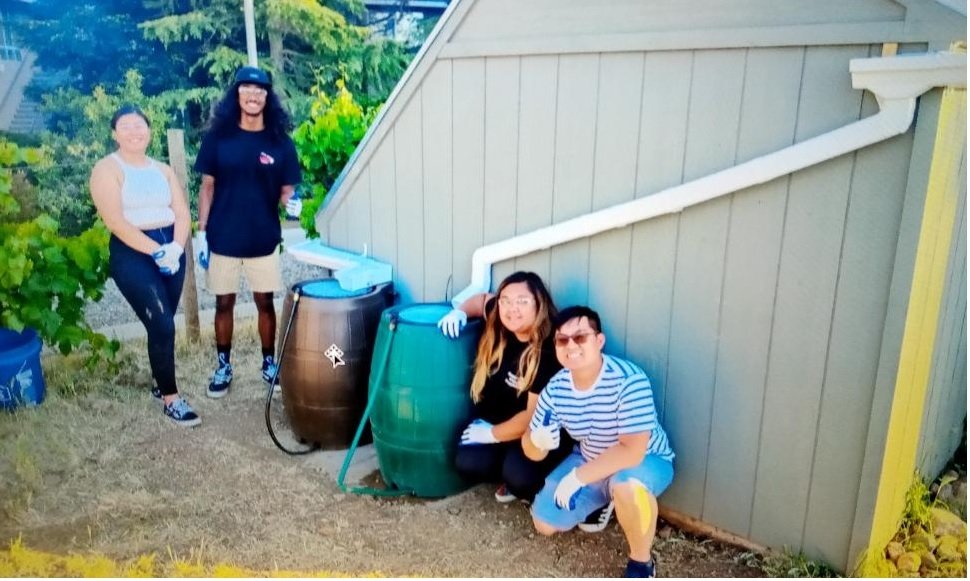   The UC Merced student team with their test-of-concept solution site on the campus. L-R: Rosa Ruiz, Kainoa Ferguson, Robylene Seapno, & Steven Nguyen.   Photo:  Rainwater Irrigation Planning team, UC Merced 