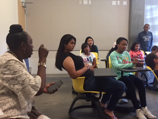  Harvest Park Education Center Managing Director Gloria Morris emphasizes a point to students and internees in the Summer Enrichment Program.  Photo by Steve Newvine 
