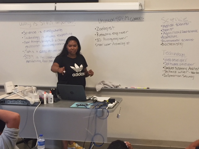  UC Student Florence presents a lesson on careers in science, technology, engineering, and math (STEM) at the Summer Enrichment Program.  Photo by Steve Newvine 